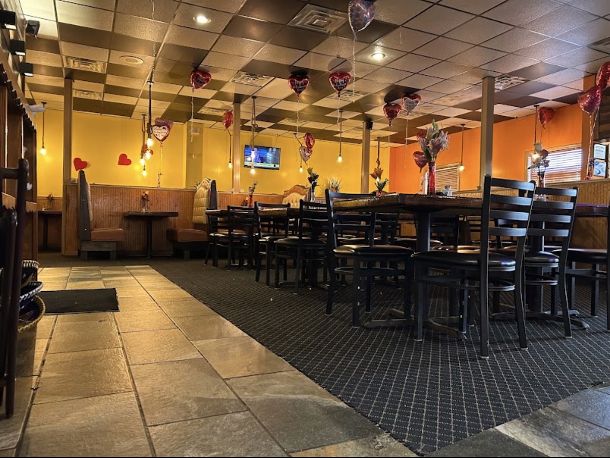 Cozy booth and table seating inside Monarcas