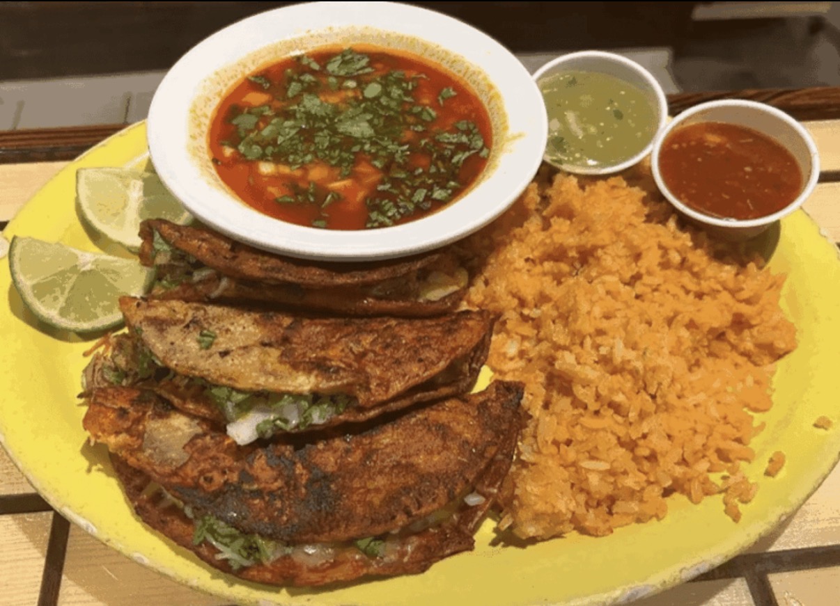 Birria tacos with consomé and Mexican rice